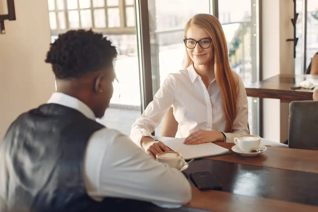 2 people talking across a table