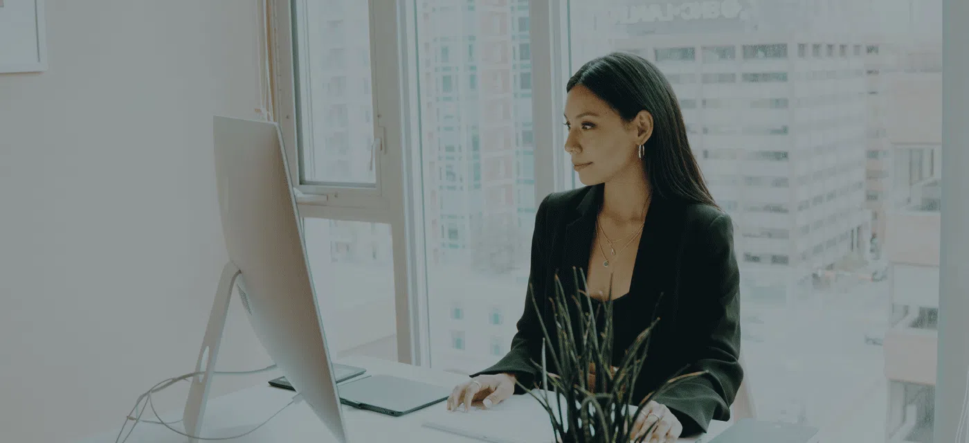 woman at desk with computer