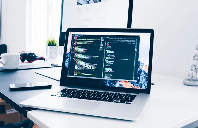 A laptop with code on the screen