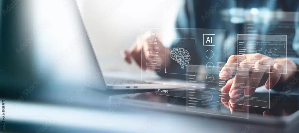 close up shot of someone using a laptop and phone with AI digital overlay