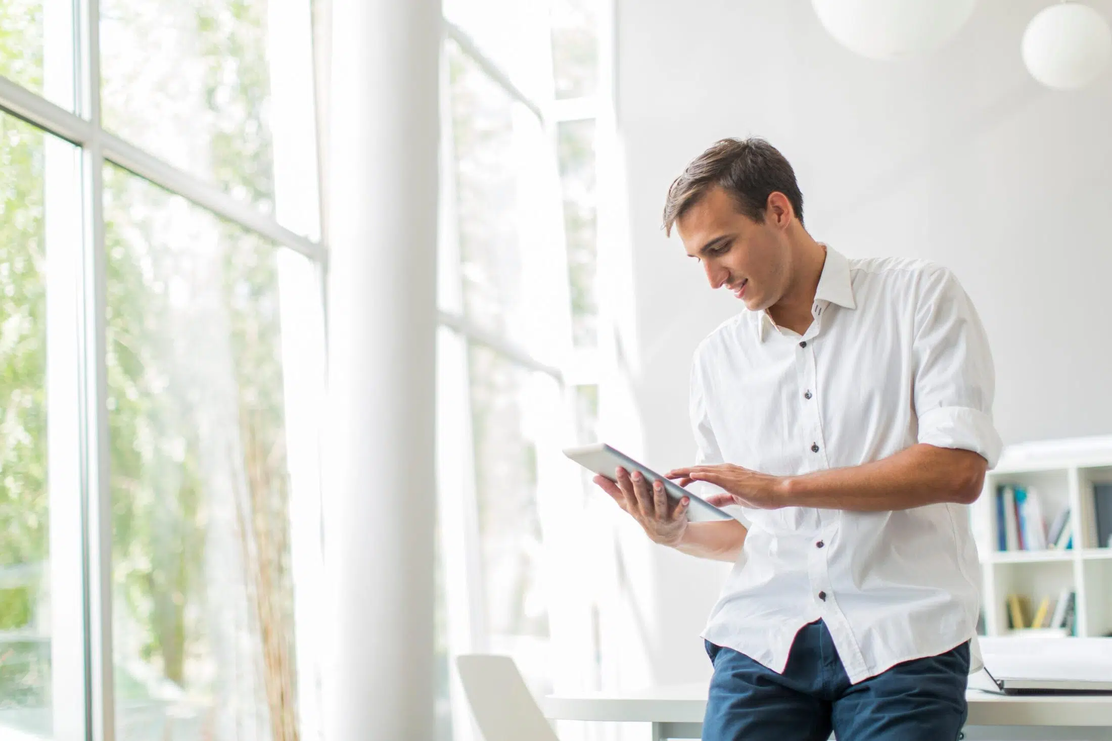 Young man with tablet in the office