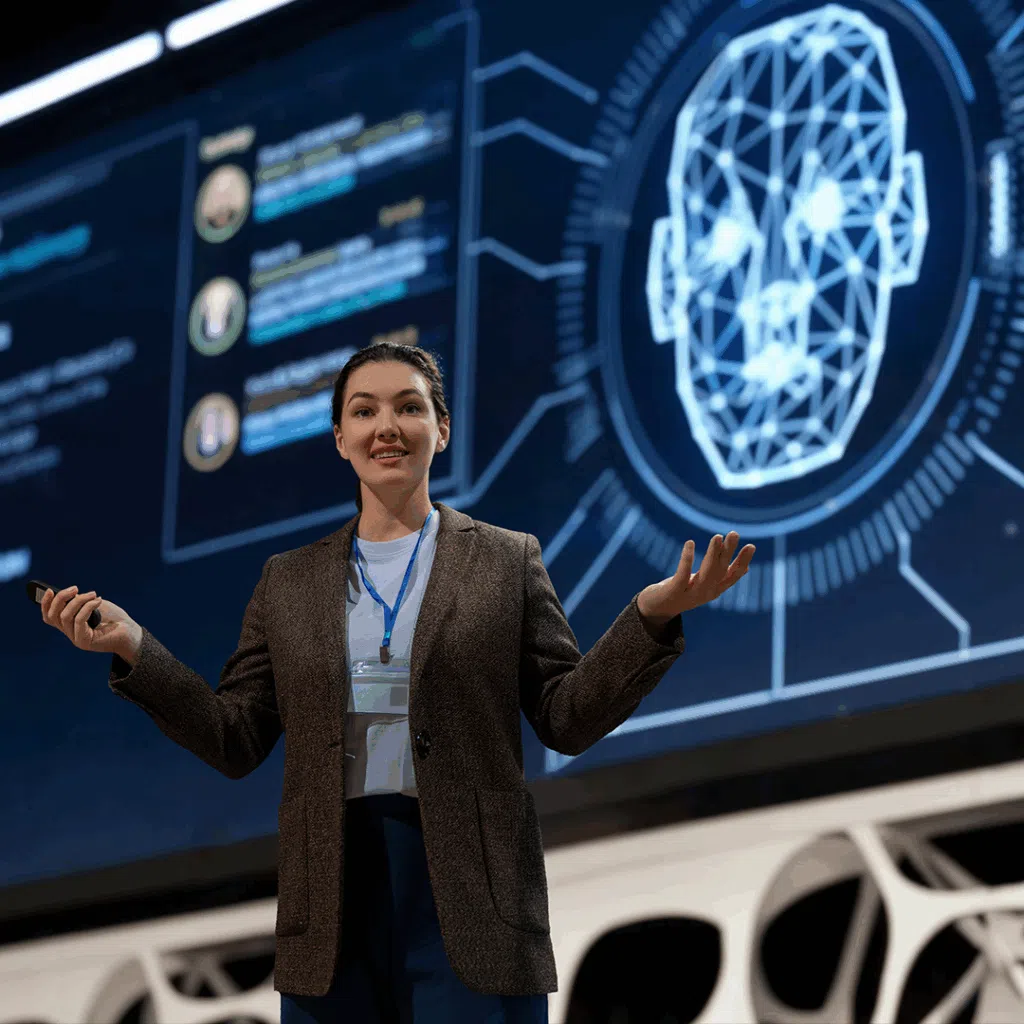 Woman speaker on stage looking at the camera. Oracle Fusion Webinar