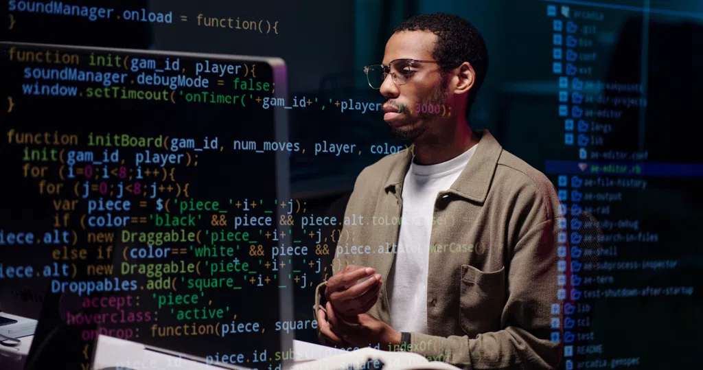 Person working at a computer with lines of programming code overlaid on the screen, illustrating software development, coding, data engineering, or AI technology.