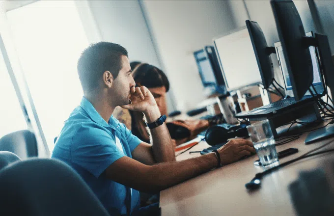 man in office working at laptop