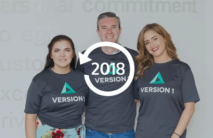 Three people in Version 1 t-shirts