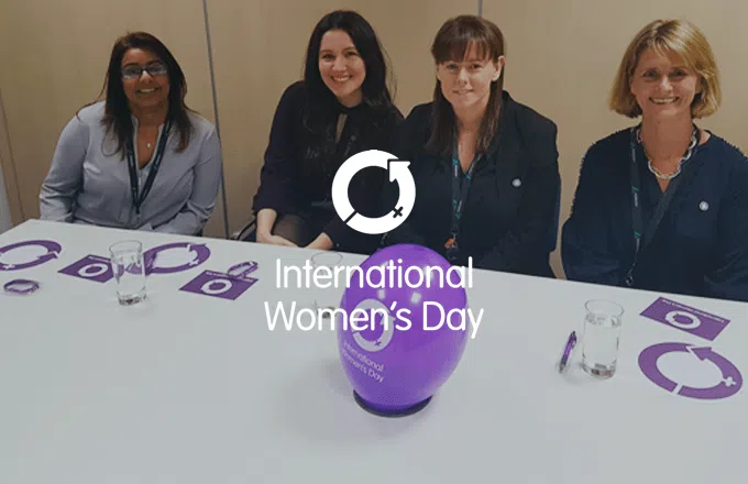 International Women's Day 2019 - 4 people sat at a table with a balloon