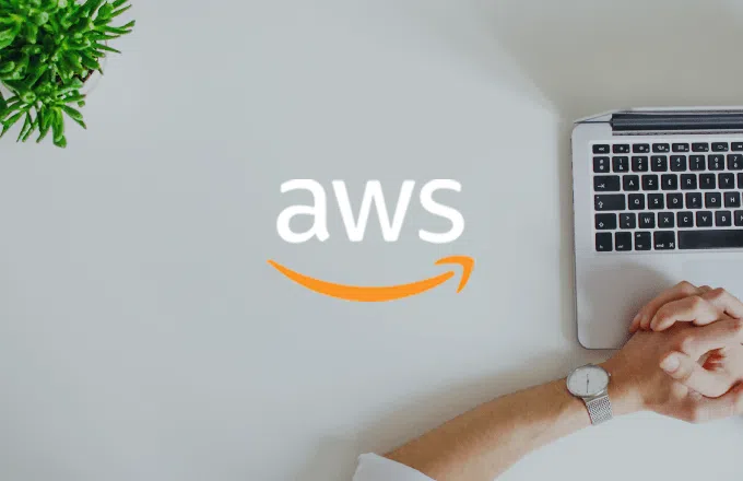 AWS logo with laptop and hands