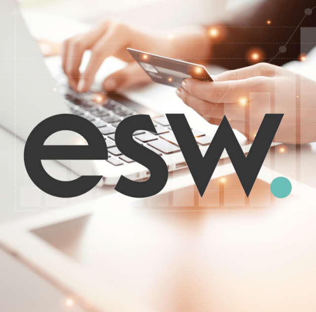 hand holding credit card in front of laptop overliad by ESHOPWORLD logo