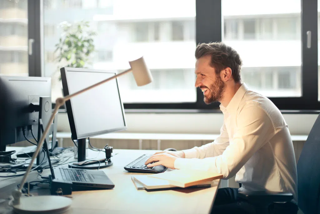 man at desk with computer