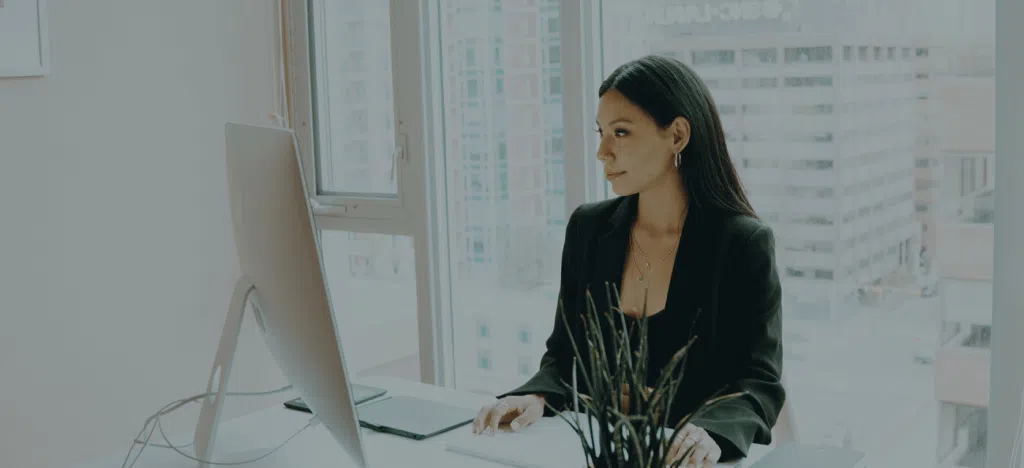 woman at desk with computer
