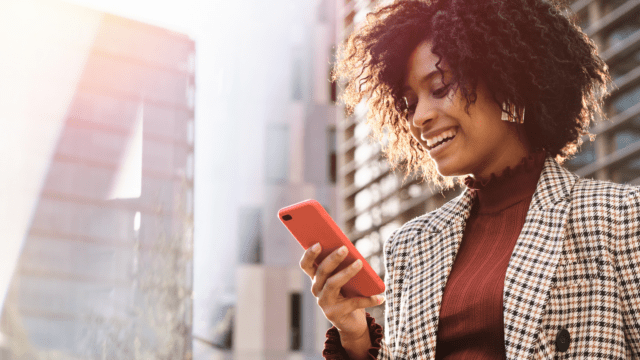 Person holding a mobile phone