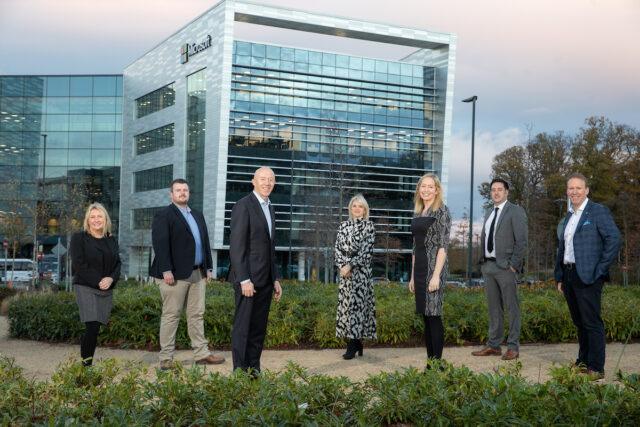 Seven people stood outside a Microsoft building