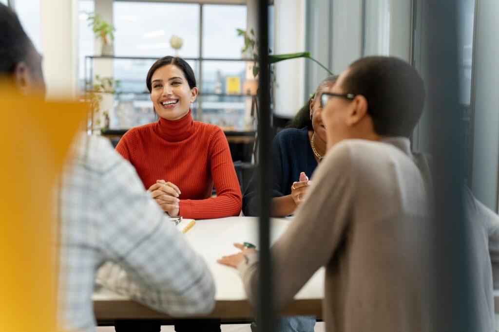 Four people around a desk