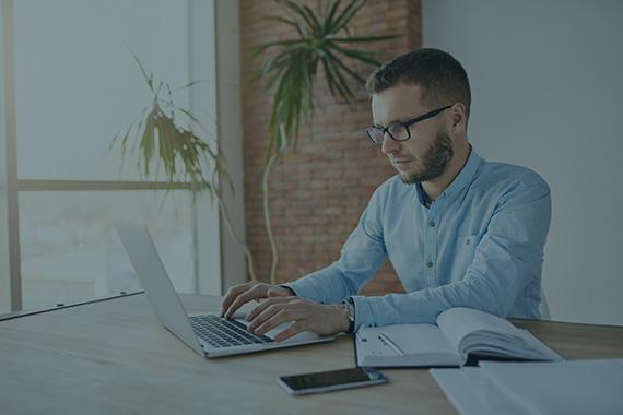 Person at desk on laptop