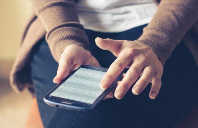hands on a smartphone