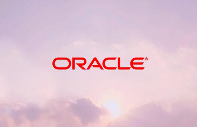 ORACLE logo laid over a pink sunset