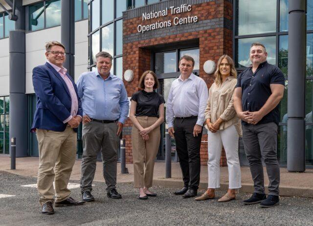6 people stood outside the National Traffic Operations Centre building