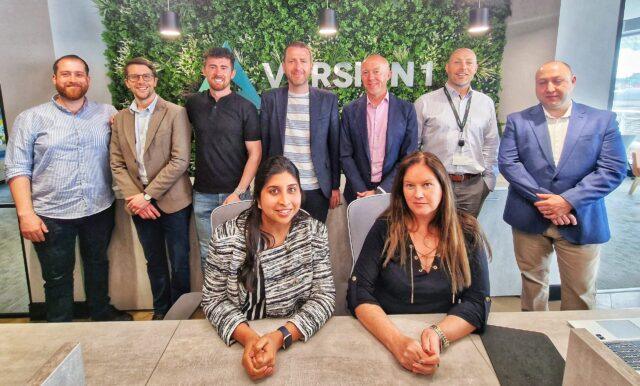 9 people sat in a Version 1 office