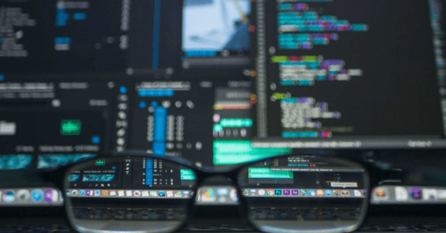computer screens seen through a pair of glasses
