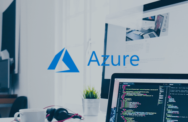 Azure logo against a laptop with code