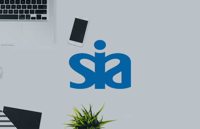SIA logo laid over a birds eye view of a desk