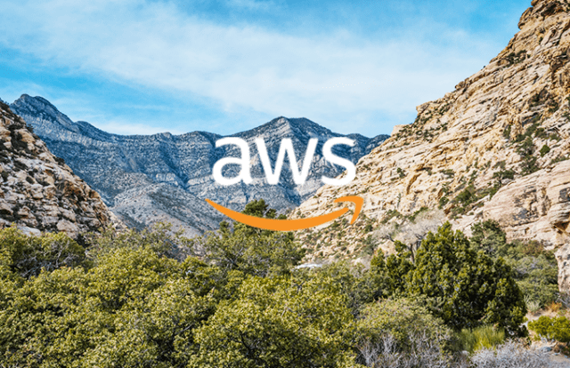 AWS logo on top of a dessert mountain landscape