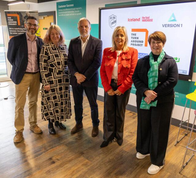 5 people standing for a press shot