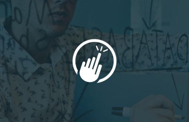 A touch icon laid over a man using a whiteboard