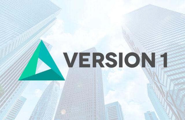 Version 1 logo laid over a skyscraper image