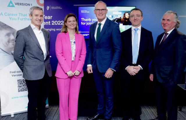 Five people dressed smartly at an event