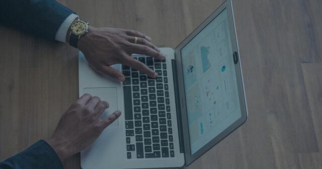 Hands at a laptop
