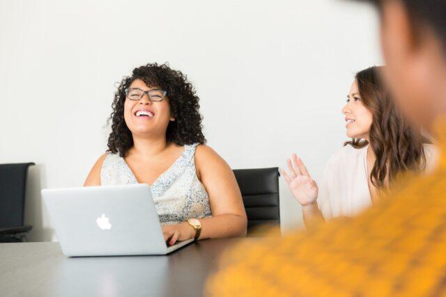 Woman smiling in a meeting