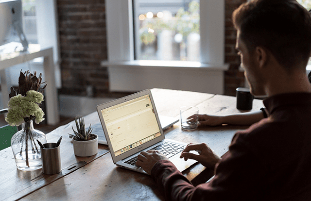 Person at desk on laptop