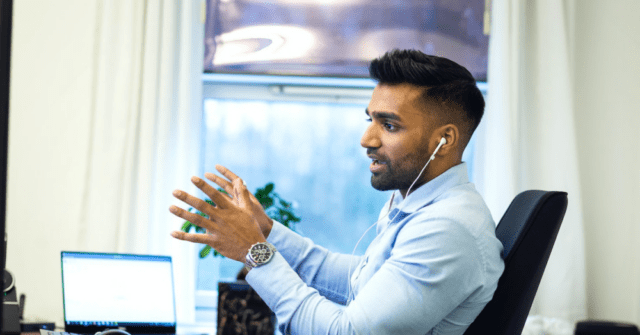 person with headphones talking on a call