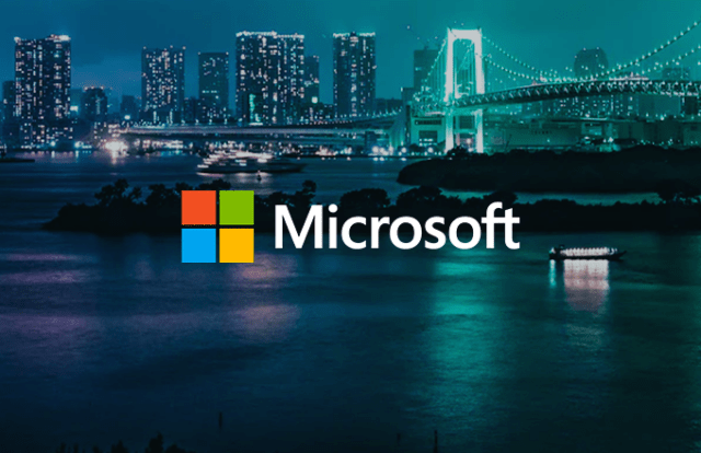 Microsoft logo against a city skyline