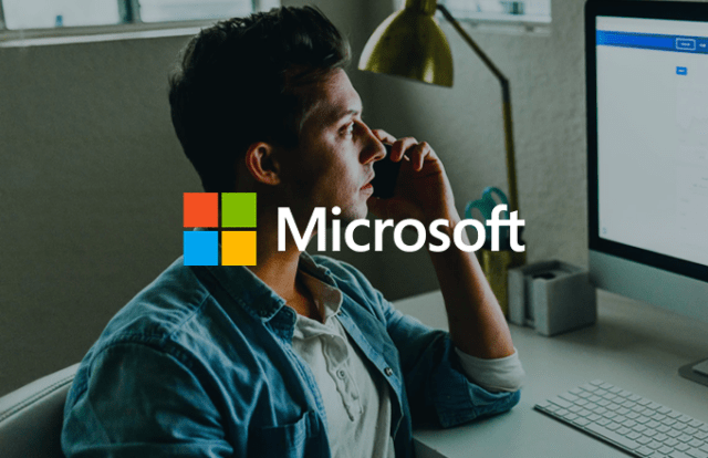 Microsoft logo laid over an image of a person at a computer