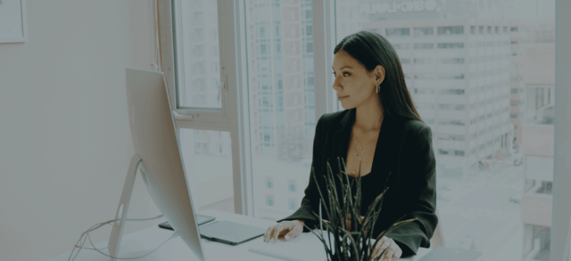 woman at desk with computer