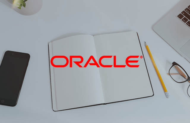 Notebook and pencil with ORACLE logo