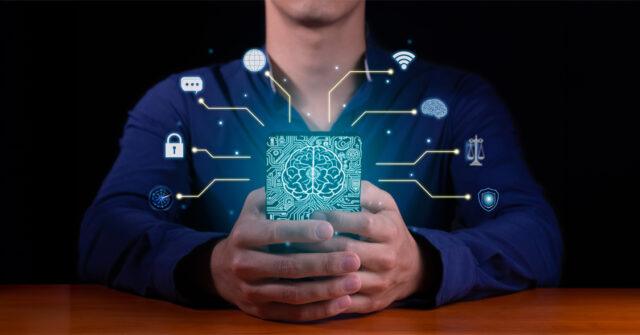 person sat at table holding phone with digital icons representing AI, ethics overlaid