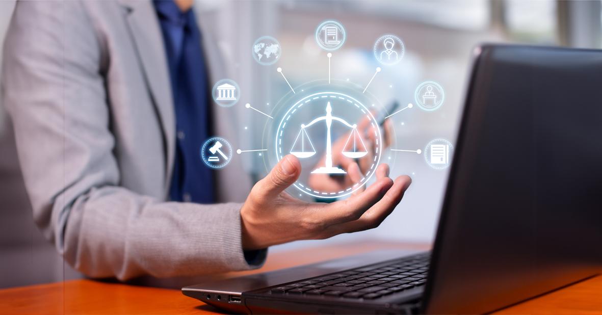 person sat at laptop with hand outstretched and digital icons representing AI and regulations overlaid