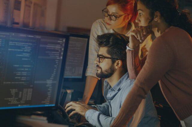 workers around a computer