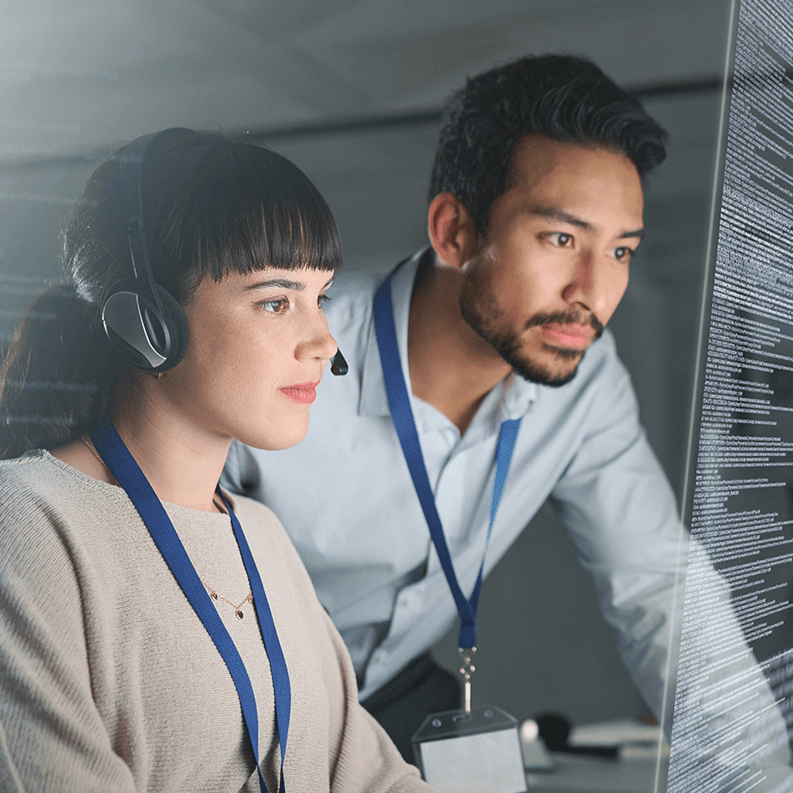 Man and women looking at computer