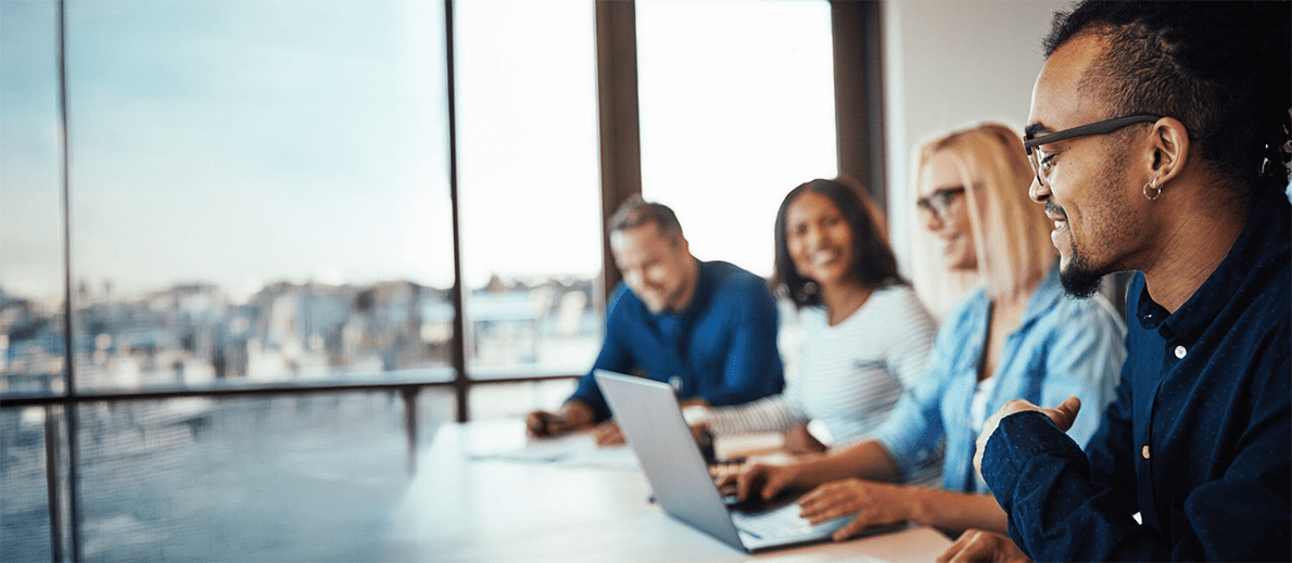Man and women using laptops