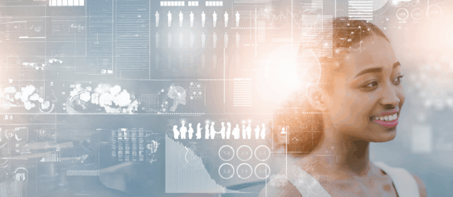 A person stands in front of a transparent digital interface displaying data visualizations, icons, and analytics related to people, networks, and technology.