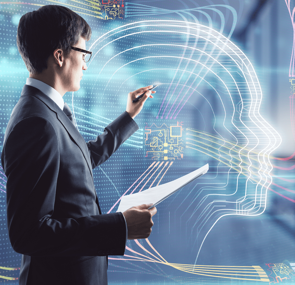 Business professional analysing AI data with digital human head interface and neural network visualisation