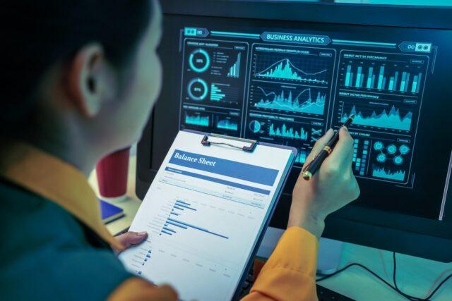 financial-analyst-examining-a-balance-sheet-at-wor-2026-01-11-10-43-56-utc-scaled.jpg