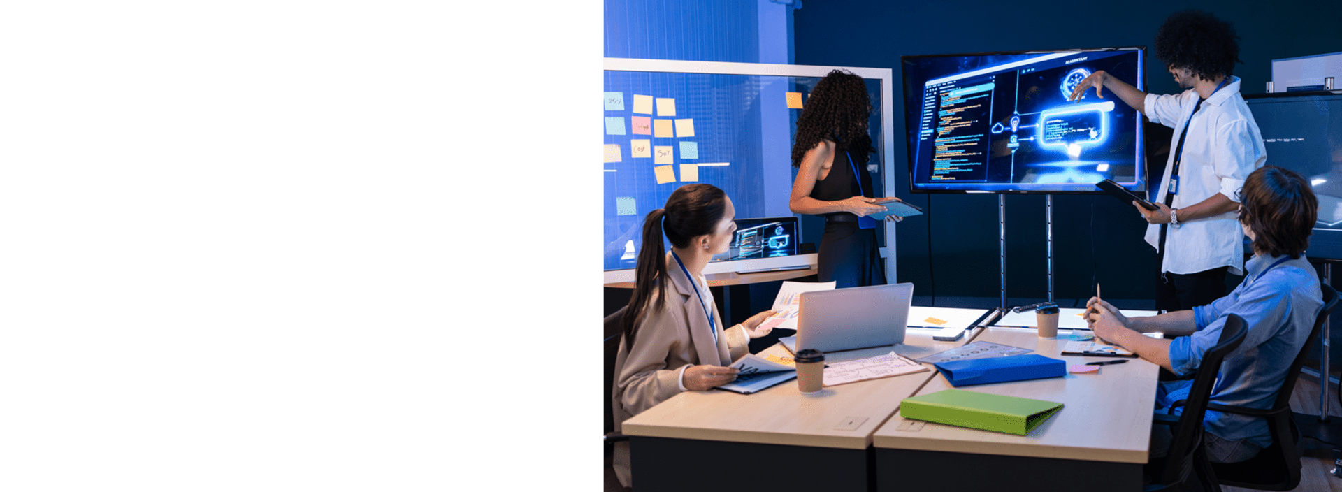 Team collaborating in a modern office, presenting AI software and code on a large screen while colleagues review data and take notes.