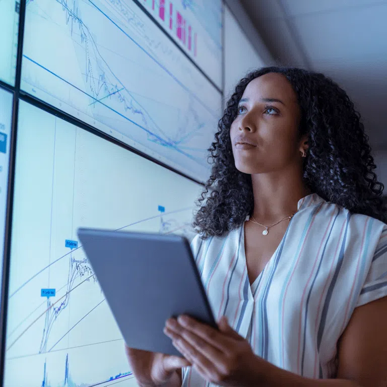 Woman with electronic tablet analysing statistics